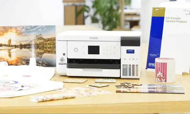 Epson SureColor SC-F100 A4 sublimation printer with sublimated mugs and transfers